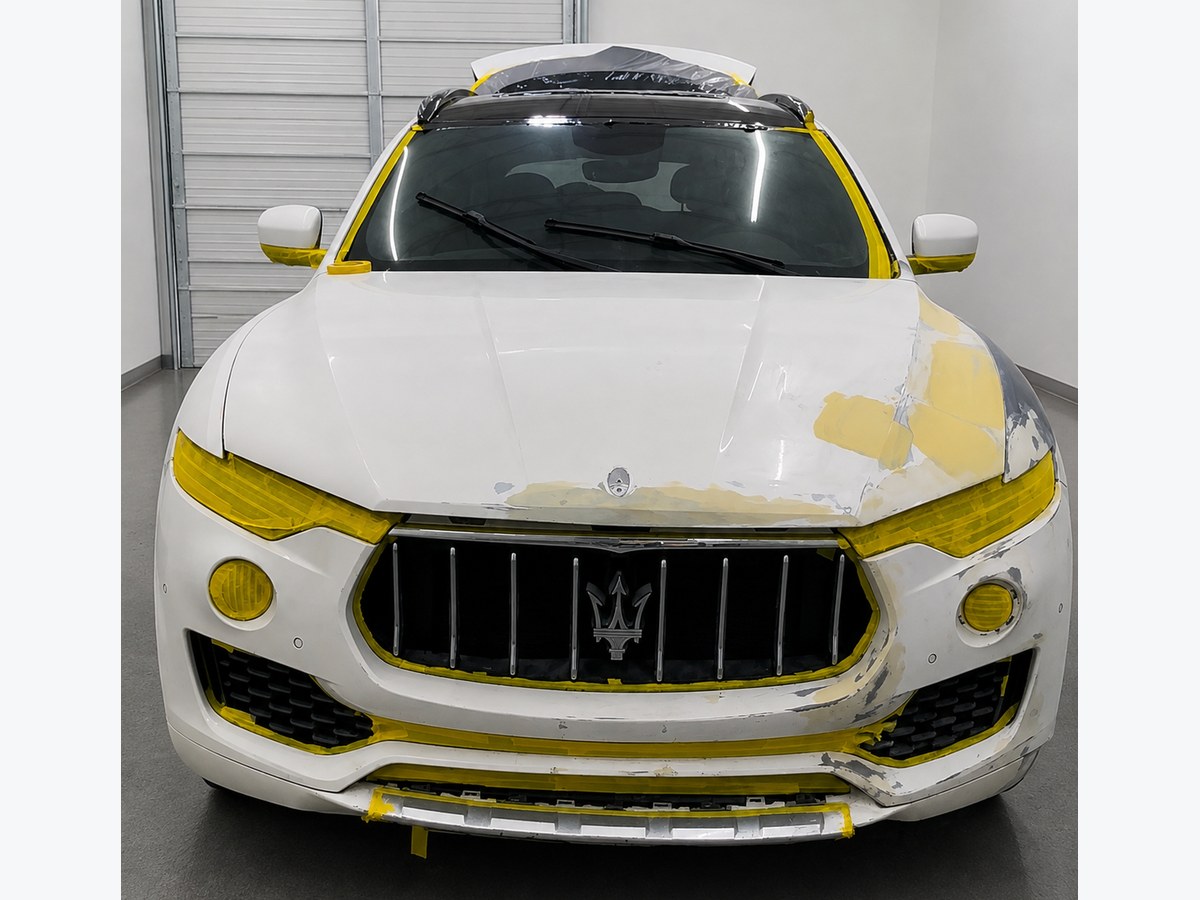 Maserati Levante front end stripped, filled and masked for refinishing at Total Care Collision, Pompano Beach FL